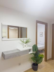 a bathroom with a sink and a mirror at Apartamento San Diego 1 - Almyra Inmobiliaria in Los Alcázares +13 photos