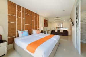 Postel nebo postele na pokoji v ubytování Sans Vibes Astana Residence Seminyak + 32 fotografií