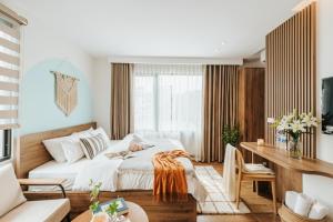 Ένα ή περισσότερα κρεβάτια σε δωμάτιο στο Crescendo Limitless Style