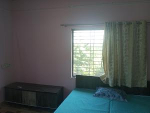 Ένα ή περισσότερα κρεβάτια σε δωμάτιο στο Falah home