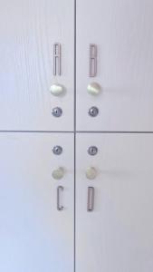 a white cabinet with four drawers with numbers on it at Zzz 台北好眠 - Monthly in Taipei