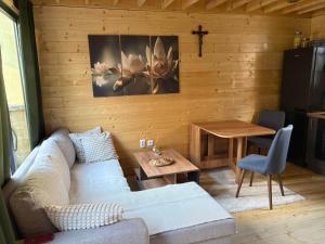 a living room with a couch and a table at Beli Bor in Vračar (historical)