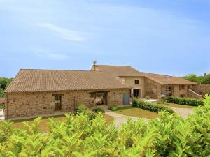 a large brick house with a yard at Holiday Home in Roussines with Private Pool in Roussines