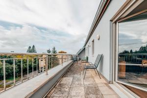 a balcony with chairs and a view at The Loft sleeps 4 in Bridel