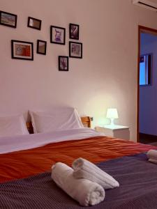 a bedroom with a bed with a stuffed animal on it at Vanchiglia 30 Guest Room in Torino