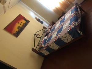 a bedroom with a bunk bed in a room at Katys Lodge in Ja-Ela