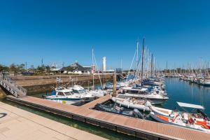 a group of boats docked in a marina at Tribord Bâbord Draps Parking Wifi in Arzon