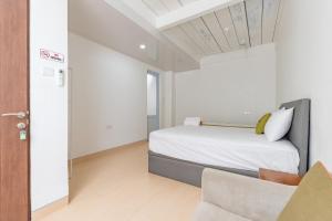 Giường trong phòng chung tại Urbanview Hotel Syariah at Rihlah Homestay Batam