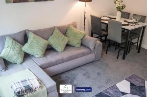 a living room with a couch and a dining room table at Charming Entire House By Newman Stays Short Lets & Serviced Accommodation Bingham With Free WiFi, Smart TV & Great Location in Bingham