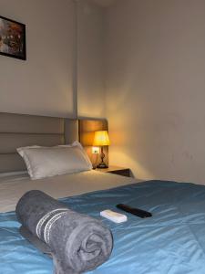 Ένα ή περισσότερα κρεβάτια σε δωμάτιο στο Visitor Stop +1 φωτογραφίες