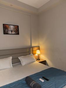 Ένα ή περισσότερα κρεβάτια σε δωμάτιο στο Visitor Stop