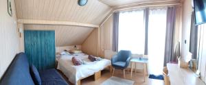 a small room with a child laying on a bed at Barbara Ház in Hévíz