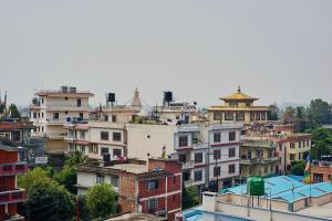 a view of a city with buildings at Bodhi house in Baudhatinchule