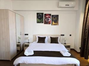 Postel nebo postele na pokoji v ubytování Green Garden Apartments