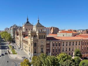 an old building in a city with a street at Espacios Blanco Santiago in Valladolid
