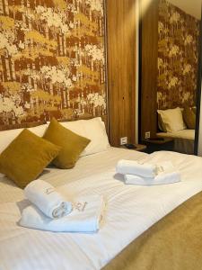 Ένα ή περισσότερα κρεβάτια σε δωμάτιο στο JiV luxury apartment i spa