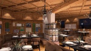 a rendering of a restaurant with tables and chairs at MyGoodLife Hotel & Bar in Gerlos
