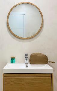 a bathroom sink with a mirror on the wall at Canaryislandshost l Orilla in Famara