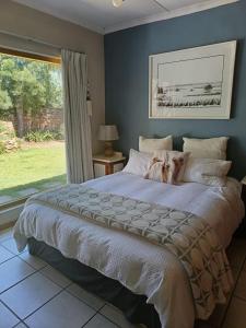 Postel nebo postele na pokoji v ubytování Stonehenge Cottage