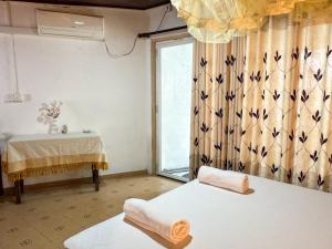 Ένα ή περισσότερα κρεβάτια σε δωμάτιο στο Gaya Place Mirissa