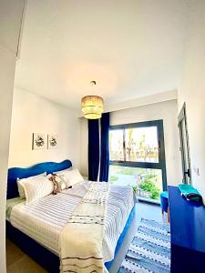 a bedroom with a large bed and a window at Luxury 4BRs Penthouse Villa, Marassi in El Alamein