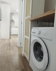 a white washer and dryer in a living room at Apartamento Casa Olalla I in La Rambla