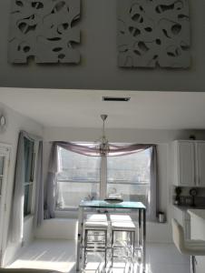 a dining room with a table and a window at Le Monye in Lewisville +11 photos