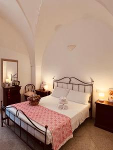 a bedroom with a bed with two towels on it at Villa Raffaella in Santa Cesarea Terme +204 photos
