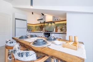a kitchen with a long wooden table and chairs at Vera home in Marmaris
