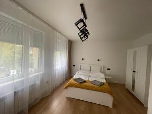 Ένα ή περισσότερα κρεβάτια σε δωμάτιο στο Apartament Cichy +7 φωτογραφίες