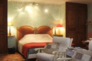 Säng eller sängar i ett rum på Maison d'hôtes Ferme de la Commanderie