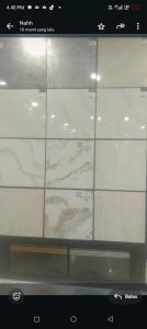 a window with white tiles on a wall at Tetebatu River Side BUNGALOWs in Tetebatu