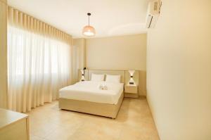 Ένα ή περισσότερα κρεβάτια σε δωμάτιο στο Al-Raha Luxury apartment +32 φωτογραφίες
