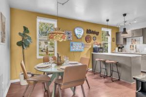 a kitchen and dining room with a table and chairs at 5 min to DT-Multicade Arcade-Scenic-Nature Trails in Nashville