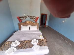 Ένα ή περισσότερα κρεβάτια σε δωμάτιο στο BOUAKHAI HOTEL Pb