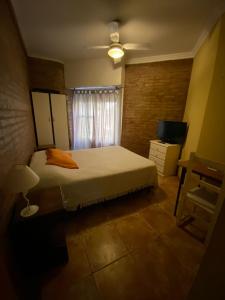 En eller flere senge i et værelse på La Casa del Paraná - San Pedro