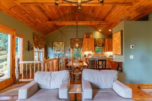 a living room with a couch and a table at Altitudes Attitude in Blowing Rock