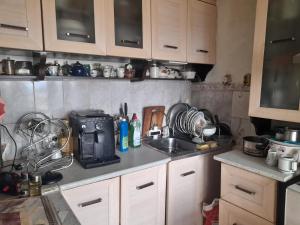 a kitchen with a sink and a counter top at Belindo in Varna City +2 photos