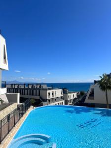 a large swimming pool on top of a building at Premium Alicante in Gran Alacant
