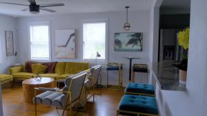 a living room with a couch and a table at Mini Boutique Hotel - THE ELLA by EVRH in Daytona Beach