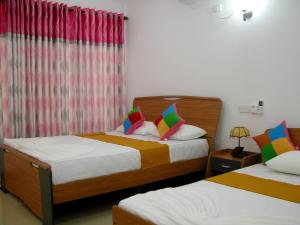 Letto o letti in una camera di Sigiri Regal Residence