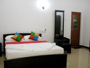 Letto o letti in una camera di Sigiri Regal Residence