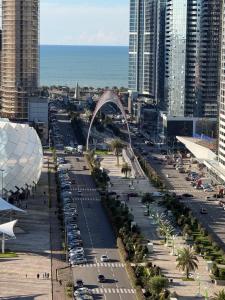 an aerial view of a city with cars parked at Gumbati 173 in Batumi