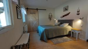 a bedroom with a bed and a window and a door at Gästhus i Röjdåfors in Östmark