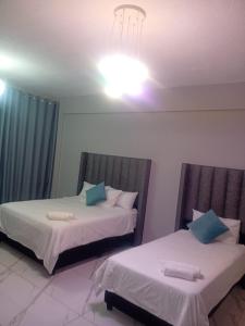 Ένα ή περισσότερα κρεβάτια σε δωμάτιο στο Beachfront Malborough court