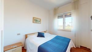 Postel nebo postele na pokoji v ubytování Re Home Riccione