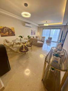 a living room with a fish tank in the middle at zayed in Sheikh Zayed