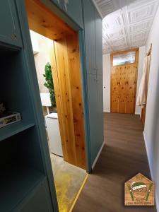 a hallway with a door open to a room at Dal Buffo Gufo in Pila
