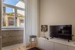 TV a/nebo společenská místnost v ubytování Casa d'Alma