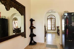 a hallway with a mirror on the wall at O'Reilly's Bungalow in Negombo